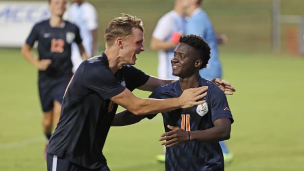 Mouhameth Thiam celebrates after scoring a goal during the Virginia men's soccer exhibition match against Villanova at Klockner Stadium.
